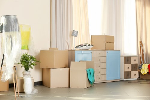 Moving van loading furniture from a Putney property on a residential street