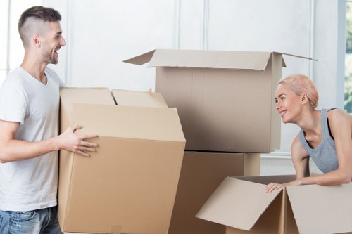Movers handling furniture in a Putney apartment building