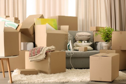 Packed boxes and wrapped furniture ready for a local removals service
