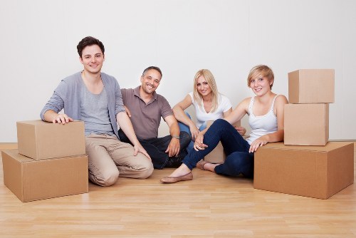Packers preparing boxes for a flat move in Putney