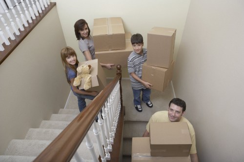 Local Putney moving team organizing boxes and furniture in transit